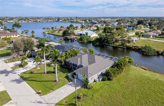 bird's eye view featuring a residential view and a water view