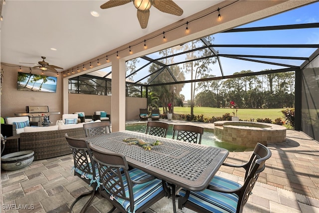 7523 Moorgate Point Way, Naples, FL 34113 - view of patio / terrace featuring an outdoor kitchen, ceiling fan, outdoor dining area, glass enclosure, and outdoor lounge area