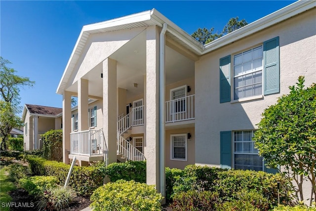 view of side of property featuring stucco siding
