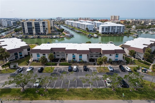 drone / aerial view with a water view and a city view