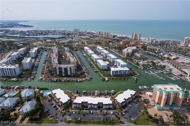 drone / aerial view featuring a water view and a view of city