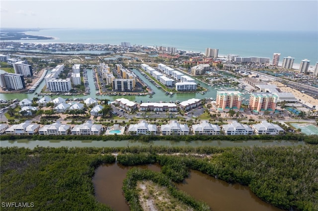 birds eye view of property with a water view and a city view