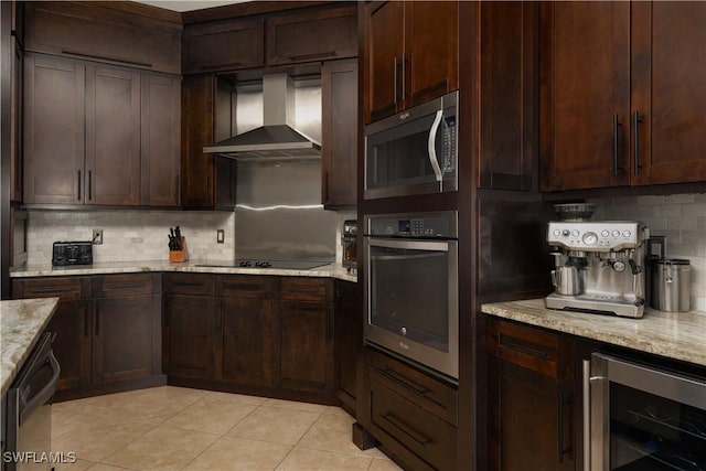 2613 Stonyhill Ct, Cape Coral, FL 33991 - kitchen with beverage cooler, light tile patterned floors, wall chimney range hood, appliances with stainless steel finishes, and tasteful backsplash