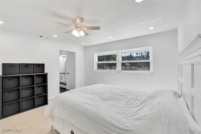 4500 1st Ave NW, Naples, FL 34119 - bedroom with visible vents, ceiling fan, recessed lighting, ensuite bath, and wood finished floors