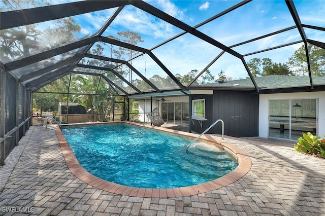 4500 1st Ave NW, Naples, FL 34119 - pool with a patio area, glass enclosure, and a ceiling fan