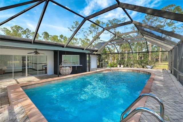 4500 1st Ave NW, Naples, FL 34119 - outdoor pool with a patio, a ceiling fan, and glass enclosure