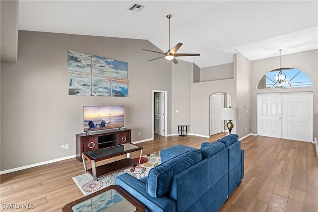 1703 SW 6th Ave, Cape Coral, FL 33991 - living area featuring arched walkways, high vaulted ceiling, wood finished floors, and ceiling fan