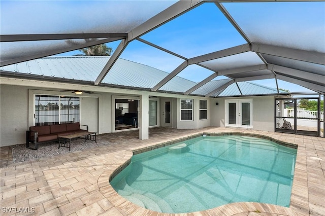 1703 SW 6th Ave, Cape Coral, FL 33991 - outdoor pool with french doors, a patio area, and glass enclosure