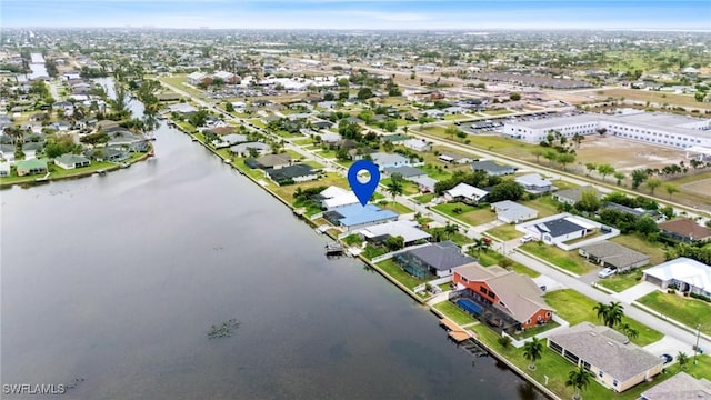 1703 SW 6th Ave, Cape Coral, FL 33991 - aerial perspective of suburban area featuring a nearby body of water