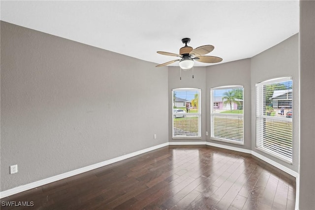 1703 SW 6th Ave, Cape Coral, FL 33991 - unfurnished room featuring dark wood-style floors, baseboards, and ceiling fan