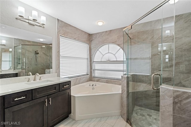 1703 SW 6th Ave, Cape Coral, FL 33991 - full bathroom featuring a bath, vanity, healthy amount of natural light, and a stall shower