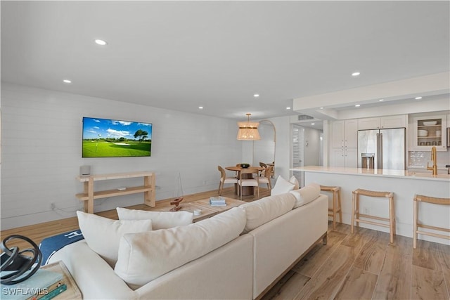 222 Harbour Dr Unit 104, Naples, FL 34103 - living area featuring light wood finished floors and recessed lighting