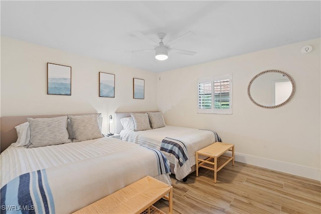 222 Harbour Dr Unit 104, Naples, FL 34103 - bedroom featuring baseboards, light wood-style floors, and ceiling fan