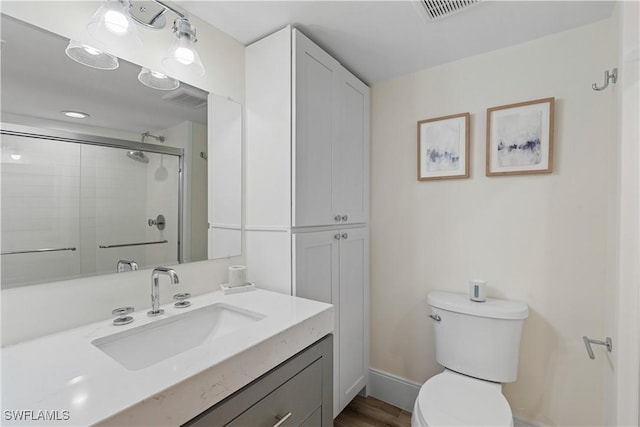 222 Harbour Dr Unit 104, Naples, FL 34103 - full bath with vanity, toilet, baseboards, a shower stall, and visible vents