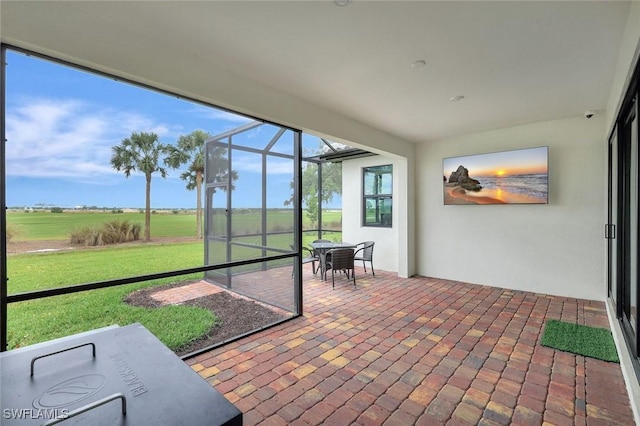 sunroom with outdoor dining space