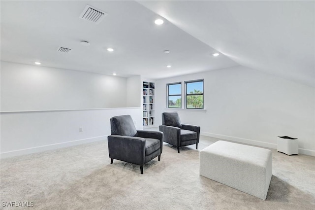 living area with baseboards, visible vents, recessed lighting, and light colored carpet