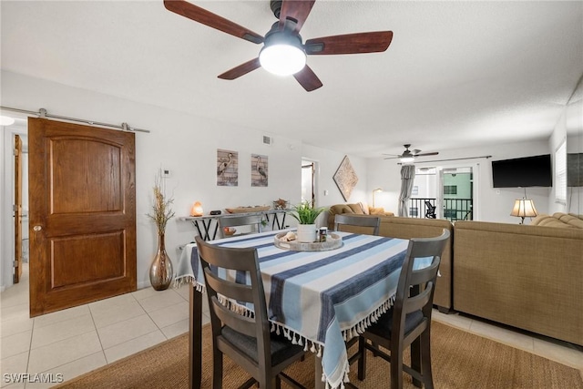 dining area featuring ceiling fan, visible vents, and light tile patterned floors