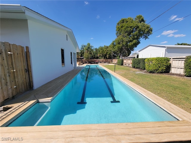 160 Coral Vine Dr, Naples, FL 34110 - view of swimming pool with a lawn, a fenced in pool, and a fenced backyard