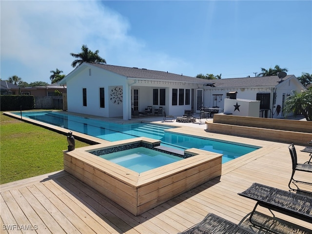 160 Coral Vine Dr, Naples, FL 34110 - view of swimming pool with a wooden deck, a pool with connected hot tub, and a yard