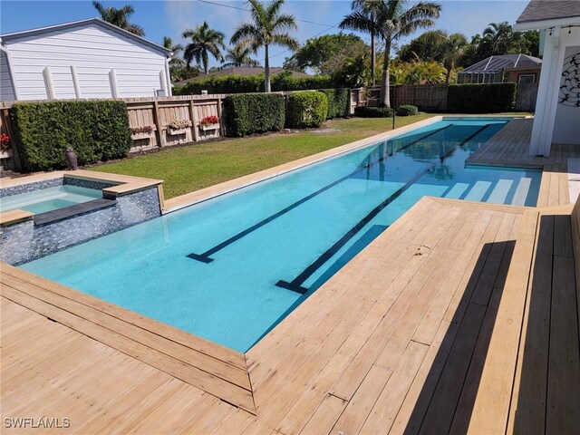 160 Coral Vine Dr, Naples, FL 34110 - view of swimming pool featuring a lawn, a fenced backyard, a wooden deck, and a pool with connected hot tub