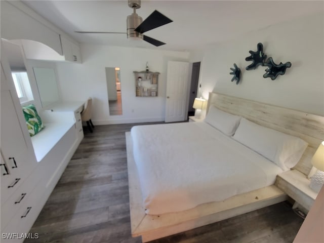 160 Coral Vine Dr, Naples, FL 34110 - unfurnished bedroom featuring dark wood-type flooring, ceiling fan, and baseboards
