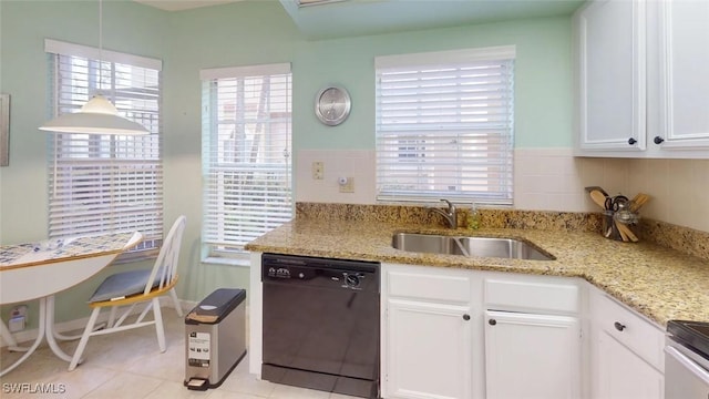 kitchen featuring dishwasher, a sink, white cabinetry, and light stone countertops