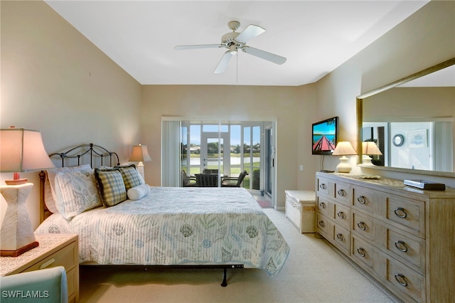 bedroom featuring access to outside, light colored carpet, and ceiling fan