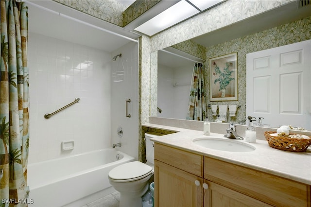 full bath with toilet, shower / bath combo, vanity, and wallpapered walls