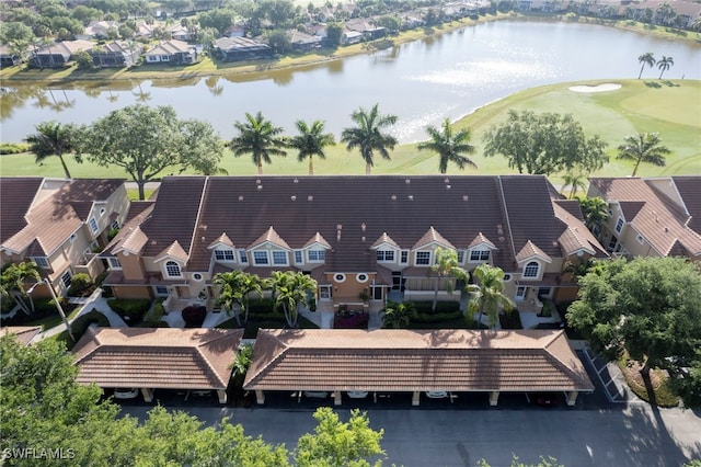 aerial view of residential area featuring a nearby body of water