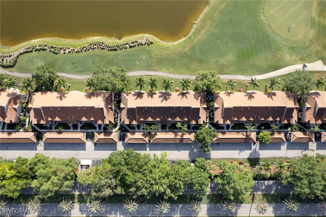 aerial view of property and surrounding area with a local golf course