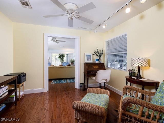 4738 Jackfish St, Bonita Springs, FL 34134 - sitting room featuring visible vents, baseboards, dark wood-style flooring, a ceiling fan, and rail lighting