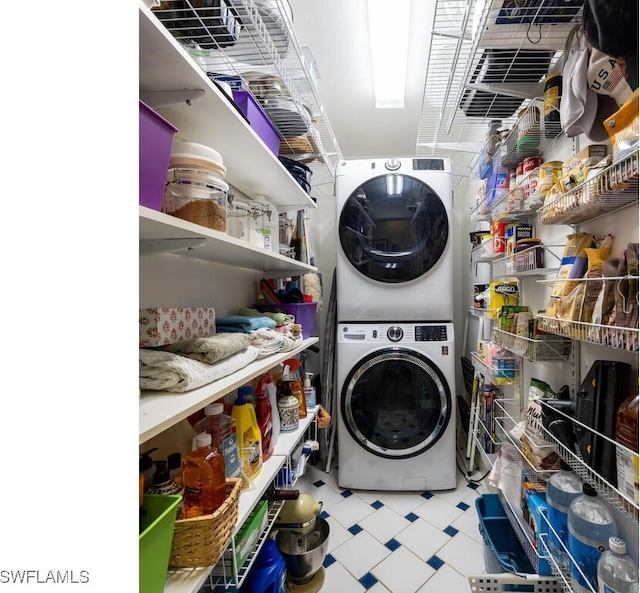 4738 Jackfish St, Bonita Springs, FL 34134 - laundry room featuring tile patterned floors, stacked washer / dryer, and laundry area