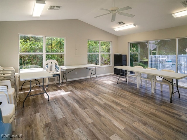 office space featuring wood finished floors, a ceiling fan, and visible vents