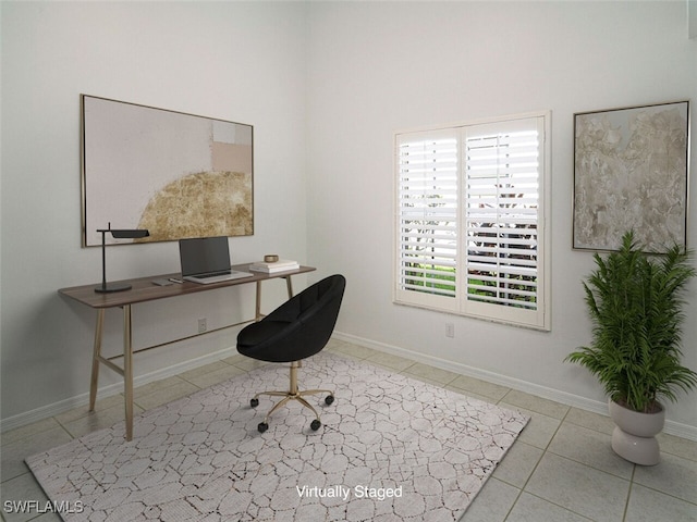 home office featuring baseboards and tile patterned flooring