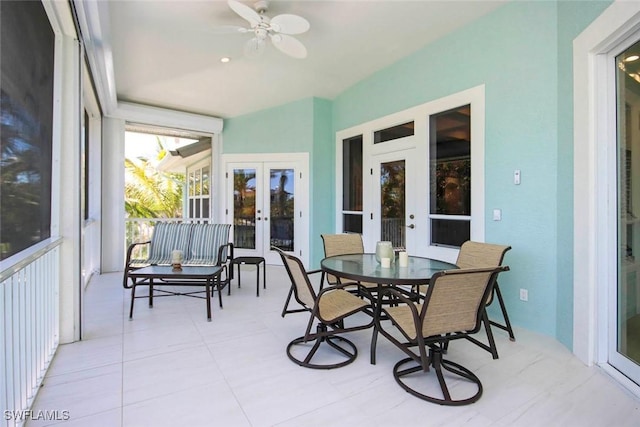 sunroom / solarium featuring french doors