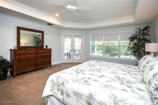 carpeted bedroom with french doors, a tray ceiling, access to outside, and crown molding