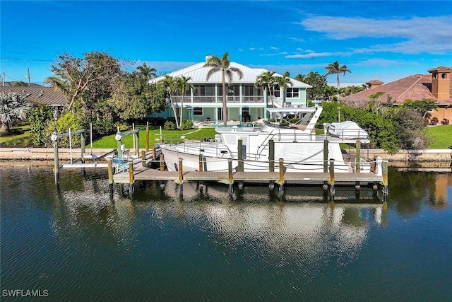 view of dock with boat lift and a water view
