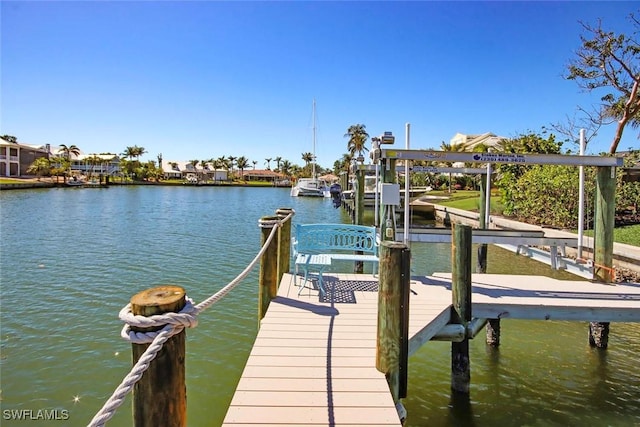 view of dock featuring a water view and boat lift