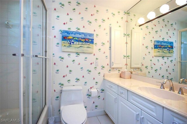bathroom with vanity, toilet, baseboards, wallpapered walls, and tile patterned floors