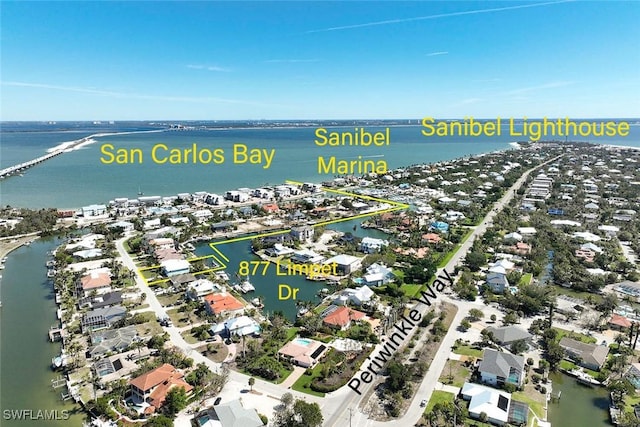 bird's eye view featuring a residential view and a water view