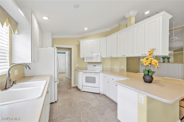 7547 Novara Ct, Naples, FL 34114 - kitchen with a peninsula, white cabinets, a sink, and white appliances