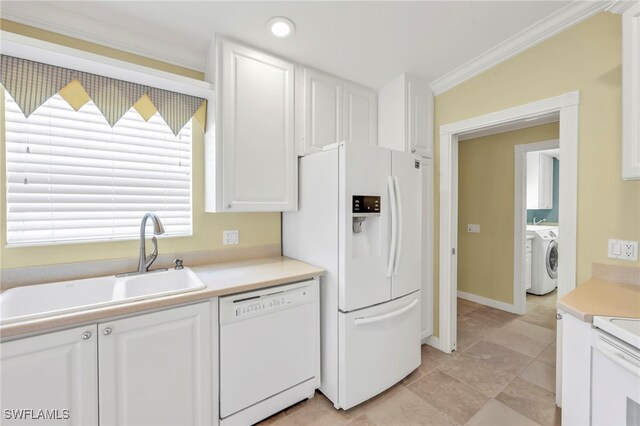 7547 Novara Ct, Naples, FL 34114 - kitchen with white cabinetry, washer / clothes dryer, ornamental molding, and white appliances