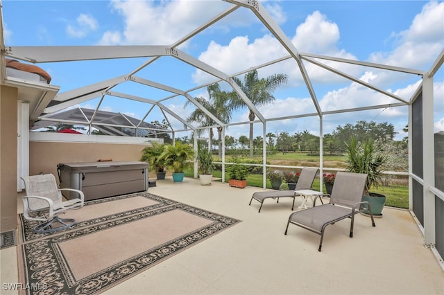 7547 Novara Ct, Naples, FL 34114 - view of patio featuring a hot tub and a lanai