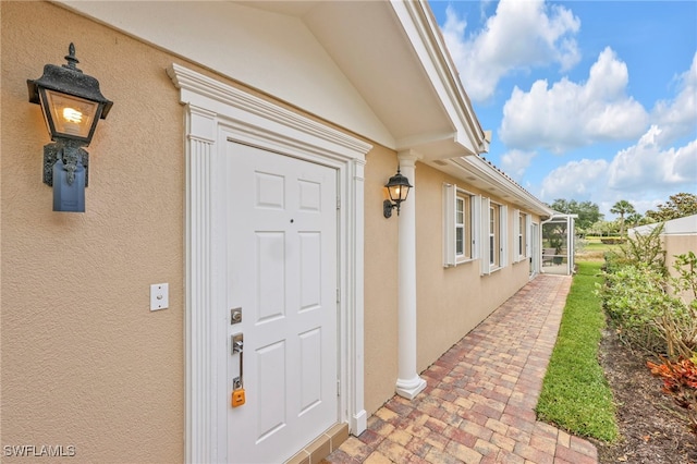 7547 Novara Ct, Naples, FL 34114 - property entrance with stucco siding