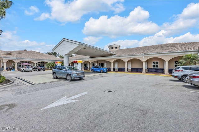 7547 Novara Ct, Naples, FL 34114 - view of building exterior with uncovered parking
