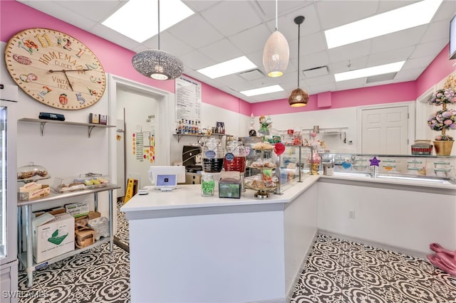 7547 Novara Ct, Naples, FL 34114 - kitchen with open shelves, hanging light fixtures, tile patterned floors, and a drop ceiling