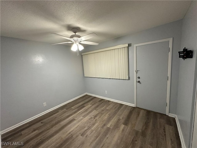 1376 Archer St Unit 6, Lehigh Acres, FL 33936 - unfurnished room featuring a ceiling fan, dark wood-style flooring, baseboards, and a textured ceiling