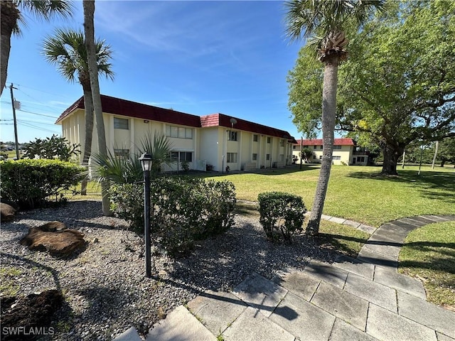 1376 Archer St Unit 6, Lehigh Acres, FL 33936 - exterior space with a front lawn