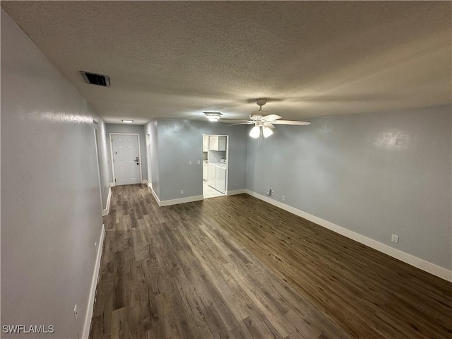 1376 Archer St Unit 6, Lehigh Acres, FL 33936 - empty room featuring dark wood-type flooring, baseboards, a textured ceiling, visible vents, and a ceiling fan