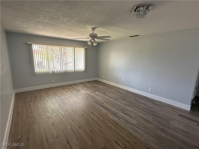 1376 Archer St Unit 6, Lehigh Acres, FL 33936 - unfurnished room with dark wood-style flooring, baseboards, a textured ceiling, visible vents, and a ceiling fan